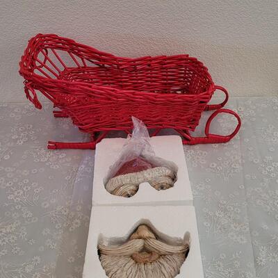 Lot 79: Vintage Red Wicker Sleigh and Santa Tree Face