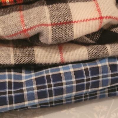 Lot 98: Mixed Polyester and Flannel Fabric (Polyester and Cotton Plaid -more than 5 yards, Flannels around 2 yards))