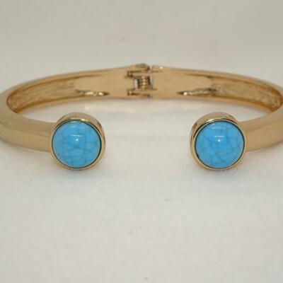 Signed NRO Gold Tone Cuff Bracelet with Turquoise colored Accents 