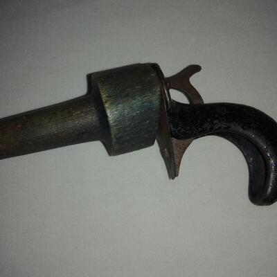 Vintage Cast iron & wood clicker gun-toy