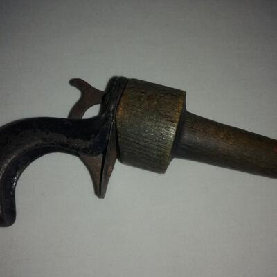 Vintage Cast iron & wood clicker gun-toy