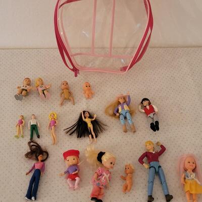 Lot 262: Mini Dolls with Bag