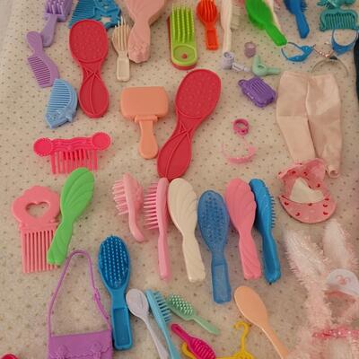 Lot 264: Vintage Barbie Clothes, Brushes, Hangers, Jewelry, Purses, Accessories & Shoes (have not matched them up)