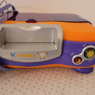 Lot 279: VTech V.Smile TV Learning System & Cartridges 