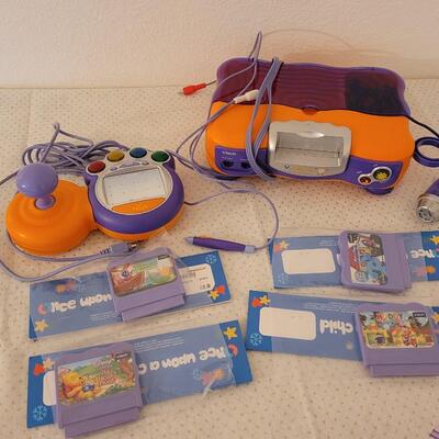 Lot 279: VTech V.Smile TV Learning System & Cartridges 