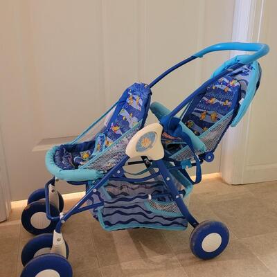 Lot 282: Doll Fisher Price Double Stroller 