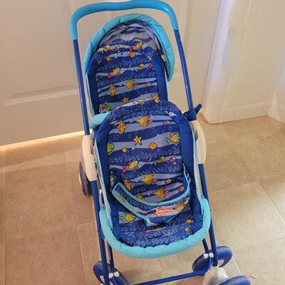Lot 282: Doll Fisher Price Double Stroller 