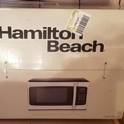 Lot #294  Hamilton Beach Stainless Microwave New in Box
