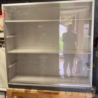 Display cabinet with walking front door on would stand