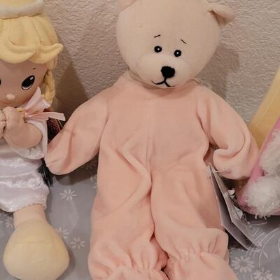 Lot 104: New Baby Girl Plushies, Praying Doll, Stroller Cover and Socks 