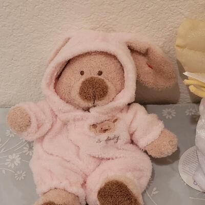 Lot 104: New Baby Girl Plushies, Praying Doll, Stroller Cover and Socks 