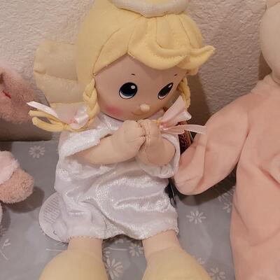 Lot 104: New Baby Girl Plushies, Praying Doll, Stroller Cover and Socks 