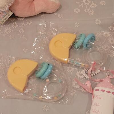 Lot 107: New Baby Girl Rattles, Musical Rabbit, Plushies, Ornament, Giraffe Curl Trinket Box and Magnet