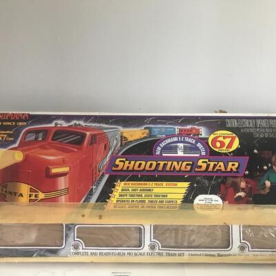 Lot 53:  Vintage Shooting Star Train, Radio Flyer Wagon, and More