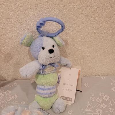 Lot 105: New Baby Boy Plushies, Praying Boy Doll and Musical Bears