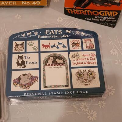 Lot 166: Crafting Lot - Rubber Stamps, Scrapbook Paper, Glue Sticks, Roller and a Holiday Planner