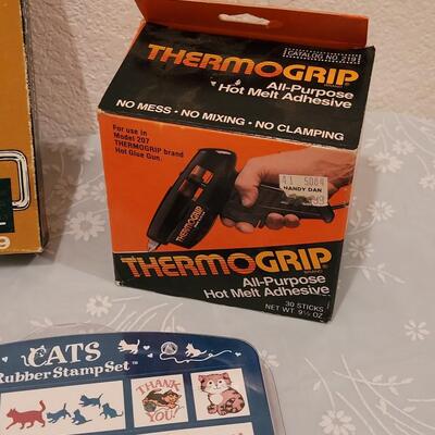 Lot 166: Crafting Lot - Rubber Stamps, Scrapbook Paper, Glue Sticks, Roller and a Holiday Planner