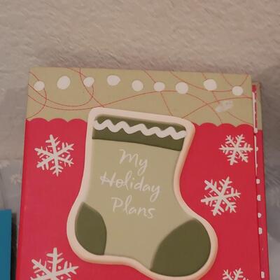 Lot 166: Crafting Lot - Rubber Stamps, Scrapbook Paper, Glue Sticks, Roller and a Holiday Planner