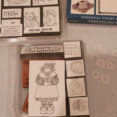Lot 166: Crafting Lot - Rubber Stamps, Scrapbook Paper, Glue Sticks, Roller and a Holiday Planner