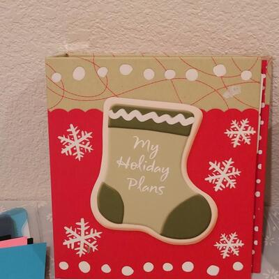 Lot 166: Crafting Lot - Rubber Stamps, Scrapbook Paper, Glue Sticks, Roller and a Holiday Planner