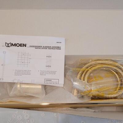 Lot 178: MOEN Polished Brass 3 Function Handheld & Slide Bar Set