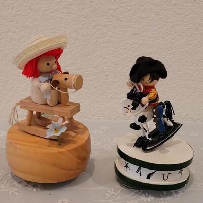 Lot 216: Vintage Boy and Girl Riding Toy Horses
