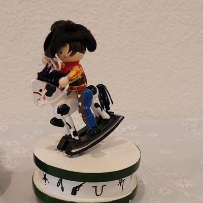 Lot 216: Vintage Boy and Girl Riding Toy Horses