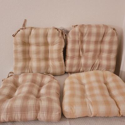 Lot 286: Set of 4 Tie On Seat Cushions (one is lighter than the others)