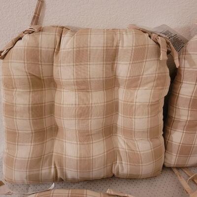 Lot 286: Set of 4 Tie On Seat Cushions (one is lighter than the others)