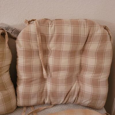 Lot 286: Set of 4 Tie On Seat Cushions (one is lighter than the others)