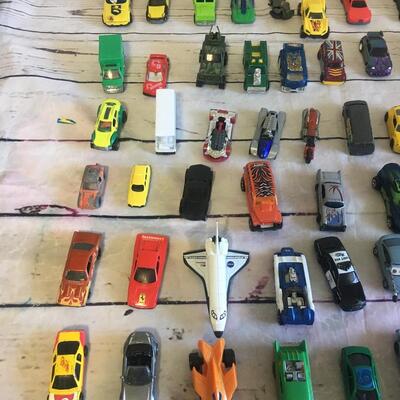 Lot of cars and trucks 76 total