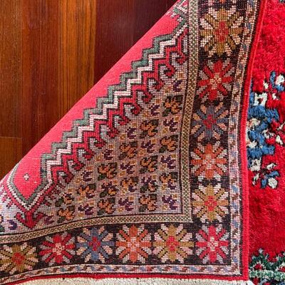 Item 7. Moroccan Rug, 1960’s, hand woven, wool, multicolored floral motifs.