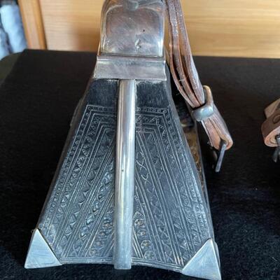 Item 11. Pair of Peruvian Pyramid shape wood and sterling silver stirrups with leather straps, circa 1900’s, country of origin Peru.