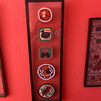 Item 38. Peruvian framed Kuna Mola textile art, five round patches, bird motifs. Circa 1970â€™s.