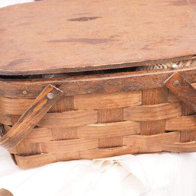 Lot 113 Scrapbook, books, rack, Vintage egg basket, thumb oil can, Basket filled with wool yarns