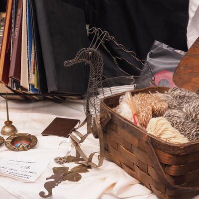 Lot 113 Scrapbook, books, rack, Vintage egg basket, thumb oil can, Basket filled with wool yarns