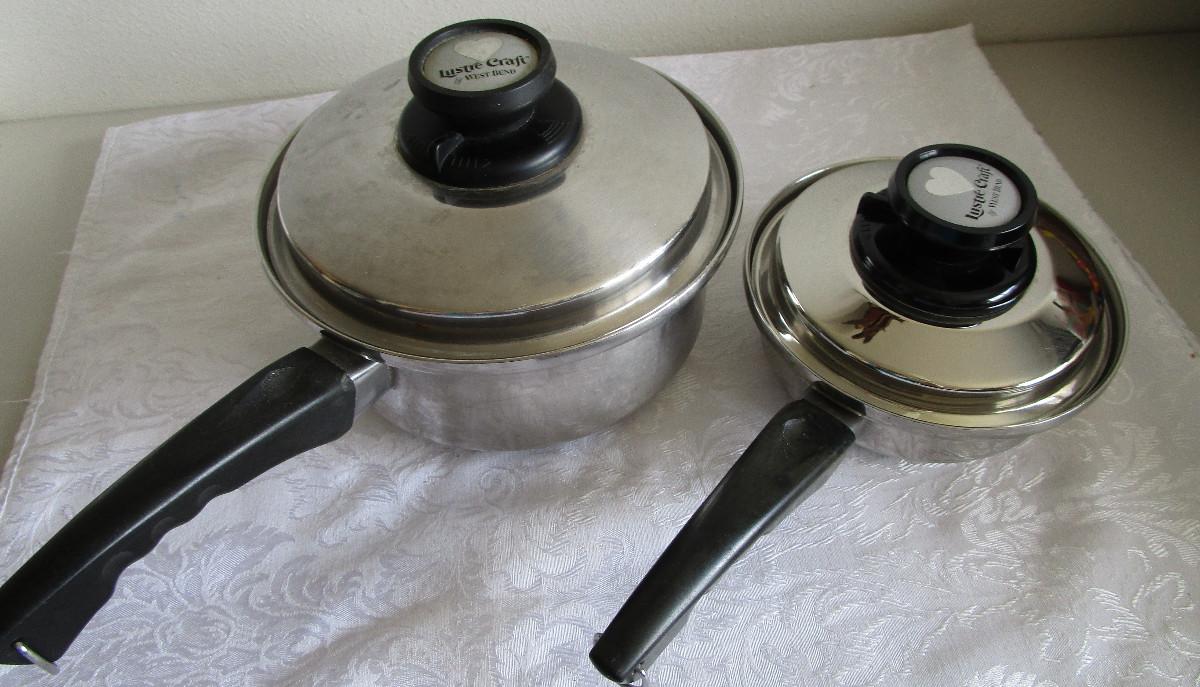 #47 Two Lustre Craft saucepans with lids | EstateSales.org