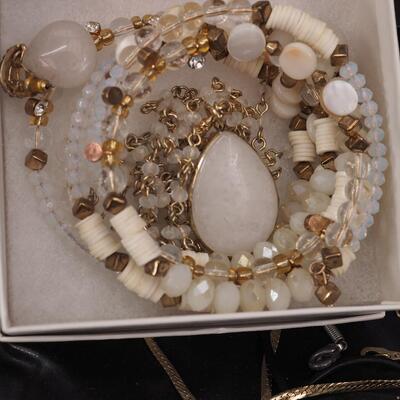 Lot 118 Necklaces and glass display