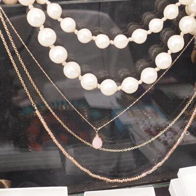 Lot 118 Necklaces and glass display