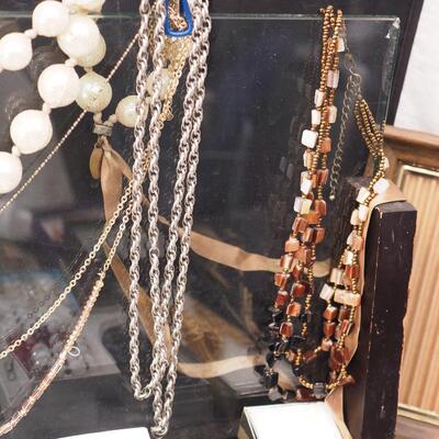 Lot 118 Necklaces and glass display