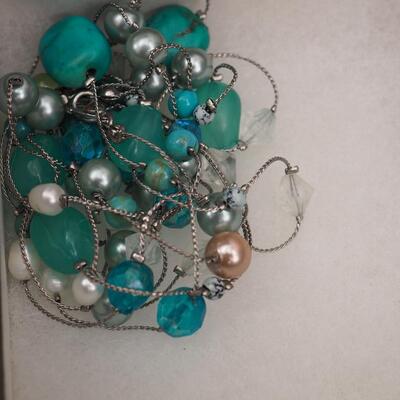 Lot 118 Necklaces and glass display