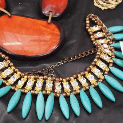Lot 118 Necklaces and glass display