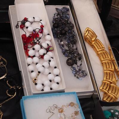 Lot 118 Necklaces and glass display
