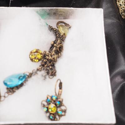 Lot 118 Necklaces and glass display