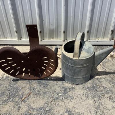 O2445 Antique Tractor Seat and Galvanized Steel Watering Can