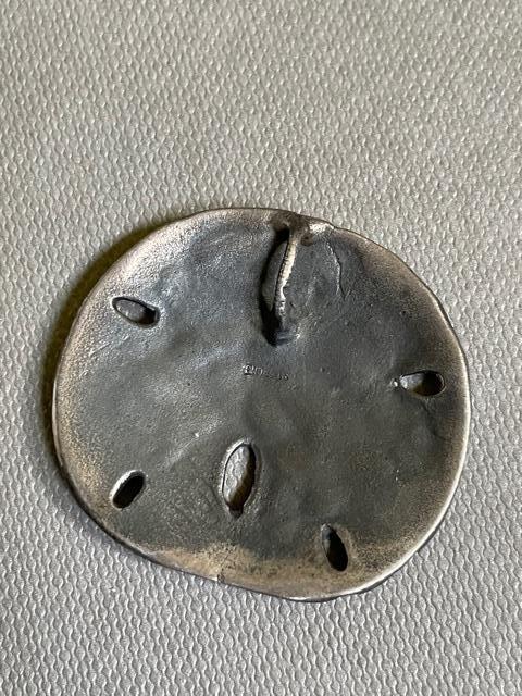 Mignon Faget sterling sand dollar pendant | EstateSales.org