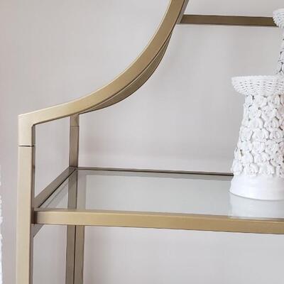 Brass and glass etagere shelves