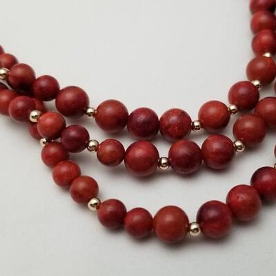 Lot #47  Triple Strand Graduated Coral Bead Necklace with 14kt gold clasp and spacers