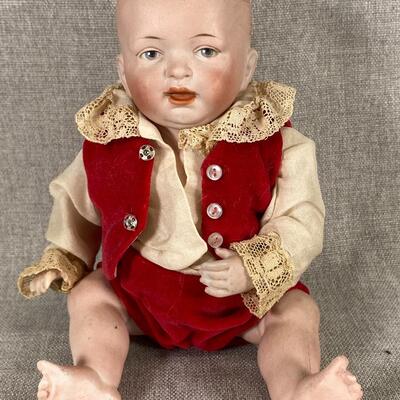 Vintage Jointed Bisque Baby Doll in Red Outfit