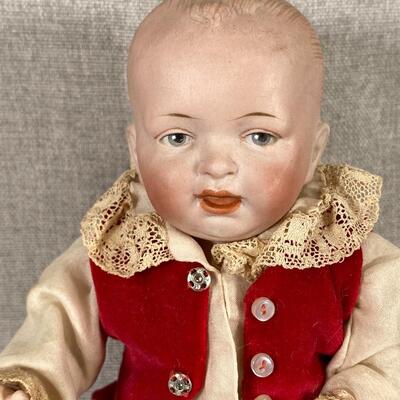 Vintage Jointed Bisque Baby Doll in Red Outfit